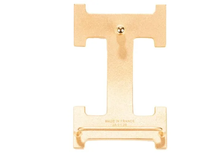 Magnífica hebilla Hermès Constance Guilloche en metal dorado 