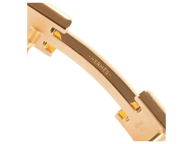 Magnífica hebilla Hermès Constance Guilloche en metal dorado 