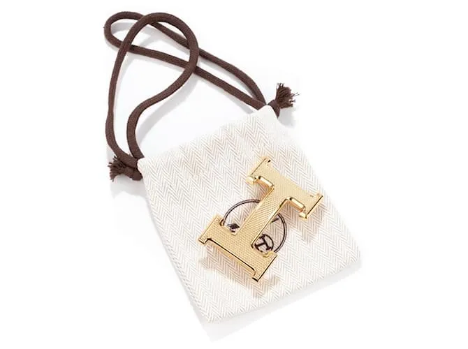 Magnífica hebilla Hermès Constance Guilloche en metal dorado 
