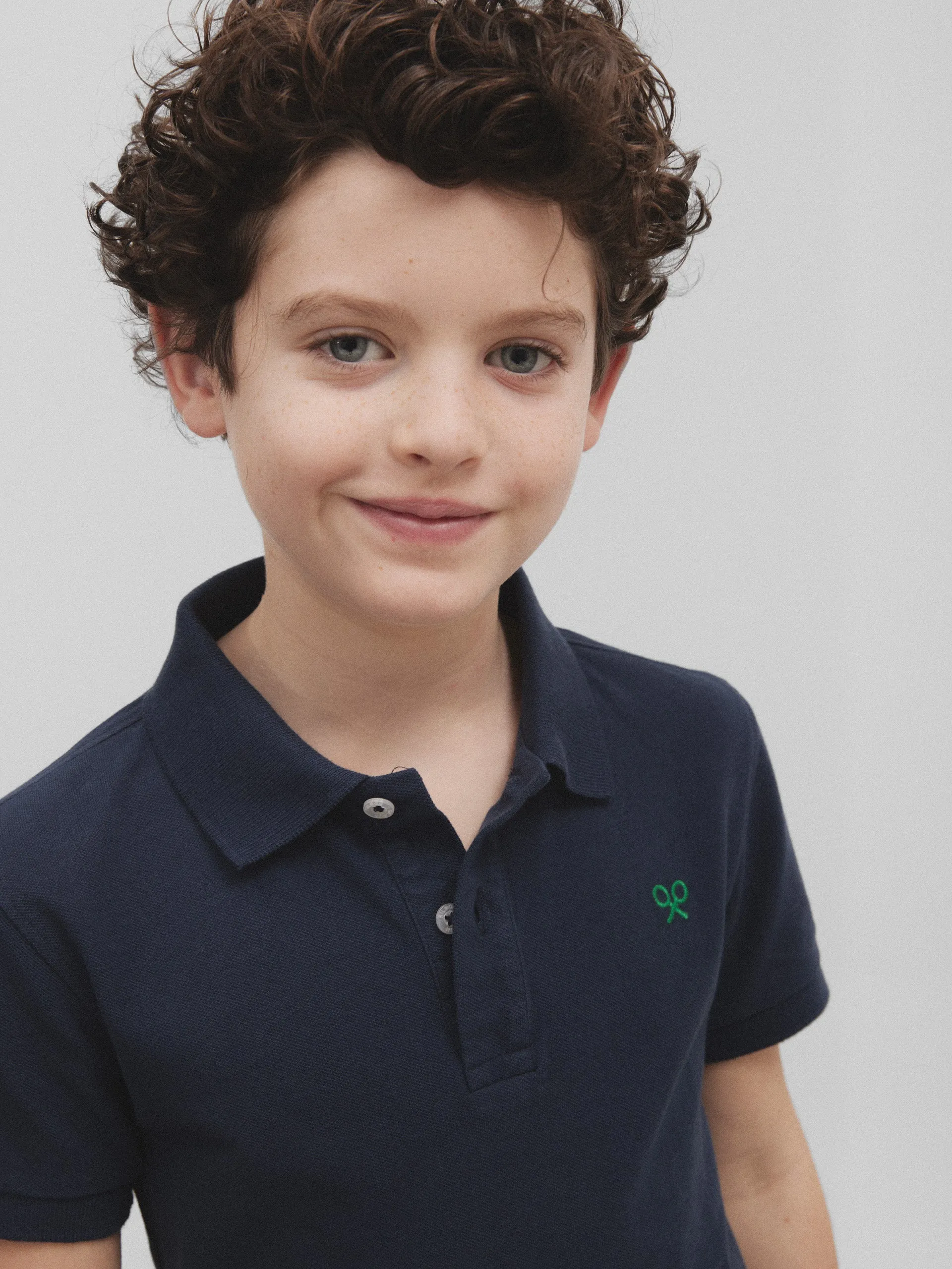 Polo kids raqueta trasera betis azul marino