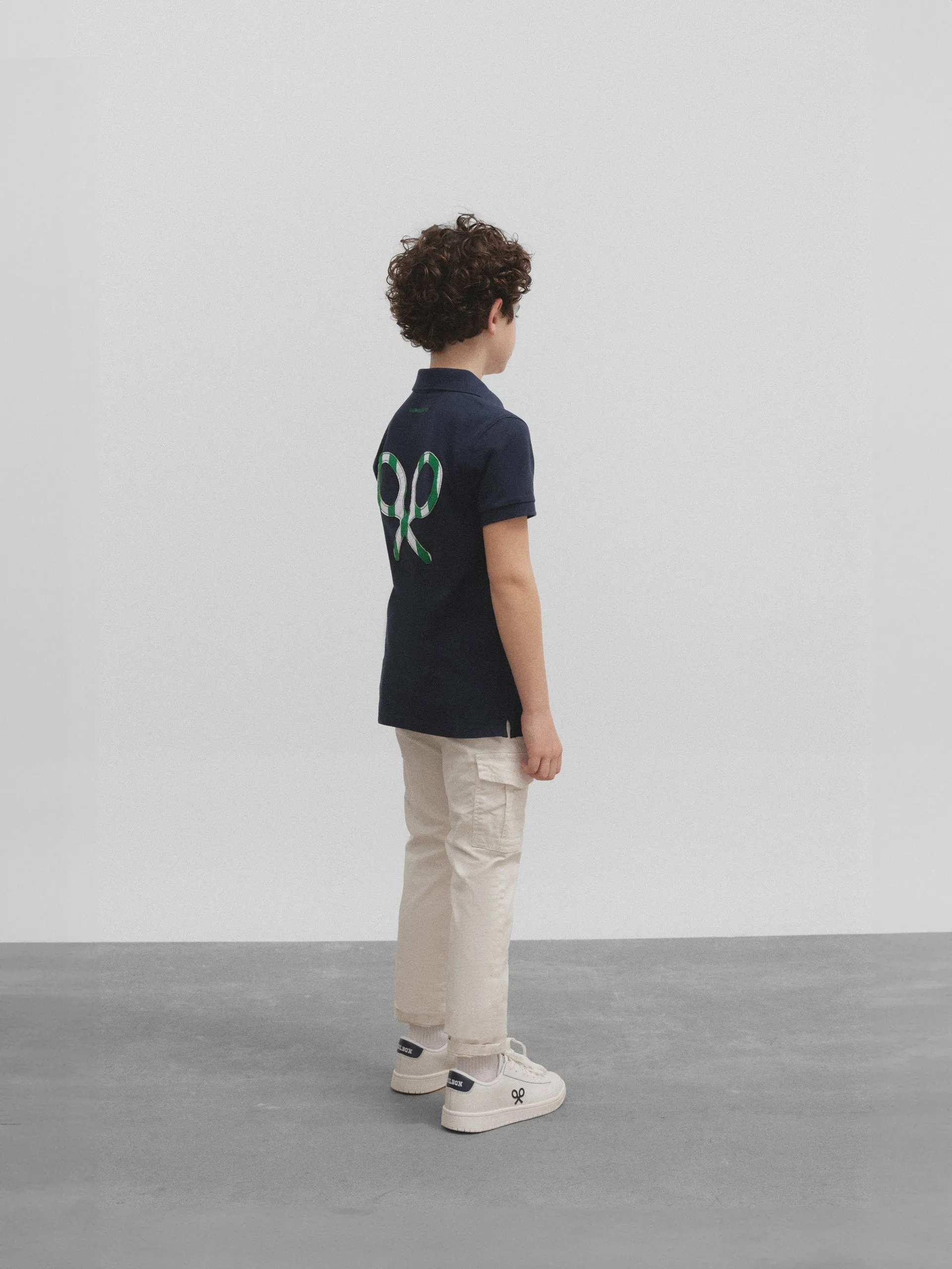 Polo kids raqueta trasera betis azul marino